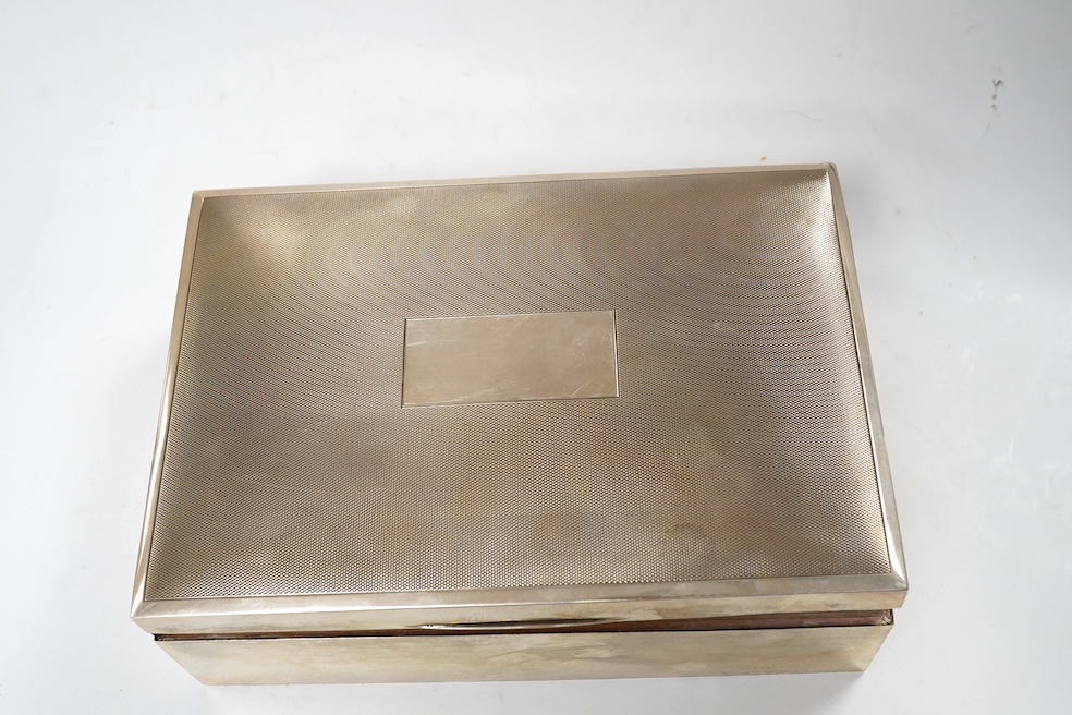 A 1970's silver mounted cigar/cigarette box, Birmingham, 1973, 22.9cm. Condition - poor